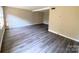 Spacious living room with modern flooring, neutral paint, and ample natural light at 4754 Old Lantern Way, Charlotte, NC 28212