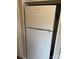 A white Whirlpool refrigerator with top and bottom compartments in a kitchen space at 4754 Old Lantern Way, Charlotte, NC 28212