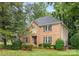 Brick home with a well-manicured lawn, mature trees, and tasteful landscaping at 4808 Cobble Glen Way, Charlotte, NC 28269