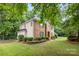 Charming two-story brick home with a well-manicured lawn and mature landscaping at 4808 Cobble Glen Way, Charlotte, NC 28269