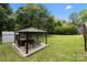 Lush backyard featuring an in-ground hot tub at 5006 Crooked Oak Ln, Charlotte, NC 28226