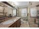 Elegant bathroom with double sinks, granite countertop, and a tiled glass shower at 5006 Crooked Oak Ln, Charlotte, NC 28226