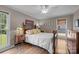 Comfortable bedroom with hardwood floors, natural light, and traditional furnishings at 5006 Crooked Oak Ln, Charlotte, NC 28226