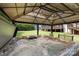 Luxurious hot tub with a retractable gazebo in a private outdoor setting at 5006 Crooked Oak Ln, Charlotte, NC 28226