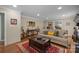 Spacious living room features hardwood floors, neutral walls, and a comfortable seating area at 5006 Crooked Oak Ln, Charlotte, NC 28226