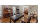 Comfortable living room featuring hardwood floors, a stylish coffee table, and a view into the adjacent dining area at 5006 Crooked Oak Ln, Charlotte, NC 28226