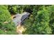 Aerial view of the wood home among the trees, showing the roof at 5212 Timber Creek Ct, Kings Mountain, NC 28086
