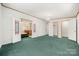 Spacious carpeted main bedroom featuring a bathroom and closets at 5212 Timber Creek Ct, Kings Mountain, NC 28086