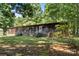 Back of wood home with stairs and a grassy backyard at 5212 Timber Creek Ct, Kings Mountain, NC 28086