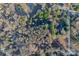 Overhead view of homes nestled among trees, featuring manicured lawns and landscaping at 529 Winding Way Way # 8, Belmont, NC 28012