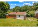 Lush green backyard showcasing the property's brick exterior and well-maintained lawn at 564 Greenway Dr, Statesville, NC 28677