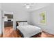 Bedroom with ceiling fan and hardwood floors with a view into the kitchen at 564 Greenway Dr, Statesville, NC 28677