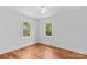 Clean, bright bedroom featuring hardwood floors and natural lighting at 564 Greenway Dr, Statesville, NC 28677