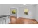 Dining area with hardwood floors, natural light, and a breakfast bar with seating at 564 Greenway Dr, Statesville, NC 28677