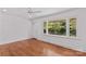 Bright and airy living room with hardwood floors, large windows, and a white front door at 564 Greenway Dr, Statesville, NC 28677