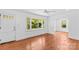 Bright living room with hardwood floors, large windows, and an open doorway at 564 Greenway Dr, Statesville, NC 28677
