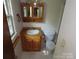 Small bathroom featuring a wood vanity, medicine cabinet, and a standard toilet at 5823 Rupert Ln, Charlotte, NC 28215