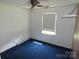 Standard bedroom with a window, ceiling fan, and wall-to-wall carpeting at 5823 Rupert Ln, Charlotte, NC 28215