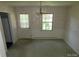Cozy dining room with chandelier and access to the backyard at 5823 Rupert Ln, Charlotte, NC 28215