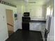 Kitchen featuring black appliances and white cabinets at 5823 Rupert Ln, Charlotte, NC 28215