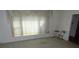 Living room with large window and neutral paint at 5823 Rupert Ln, Charlotte, NC 28215