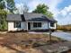 Charming single-story home with a new driveway, a mailbox, and black window shutters at 723 Taylor St, Rock Hill, SC 29730