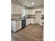Bright kitchen equipped with granite countertops, white cabinetry, and stainless steel appliances at 723 Taylor St, Rock Hill, SC 29730