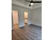 Spacious bedroom with sleek floors, neutral walls, tray ceiling, and ensuite bathroom access at 723 Taylor St, Rock Hill, SC 29730