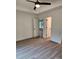 Spacious bedroom with sleek floors, neutral walls, tray ceiling, ceiling fan, and access to other rooms at 723 Taylor St, Rock Hill, SC 29730