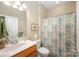 Bathroom featuring a shower curtain, a sink, and a mirror at 7406 Carolina Jessamine Ct, Indian Land, SC 29707