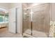 Bathroom featuring a tiled shower, a glass door, and a view of the bedroom at 7406 Carolina Jessamine Ct, Indian Land, SC 29707