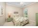 Cozy bedroom featuring a window, dresser, and decor above the bed at 7406 Carolina Jessamine Ct, Indian Land, SC 29707