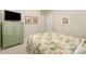 Neutral bedroom featuring a dresser and colorful bed at 7406 Carolina Jessamine Ct, Indian Land, SC 29707