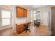 Eat-in kitchen with breakfast nook with table, office desk, and granite counters at 7406 Carolina Jessamine Ct, Indian Land, SC 29707