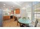 Eat-in kitchen with breakfast nook table, granite counters, and modern appliances at 7406 Carolina Jessamine Ct, Indian Land, SC 29707