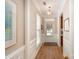 Inviting entryway with hardwood floors, decorative molding, and a front door with sidelights at 7406 Carolina Jessamine Ct, Indian Land, SC 29707