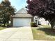 Traditional-style home featuring a spacious two-car garage, brick facade, and a well-maintained front yard at 7406 Carolina Jessamine Ct, Indian Land, SC 29707