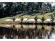 Scenic golf course view with water features and sand traps at 7406 Carolina Jessamine Ct, Indian Land, SC 29707