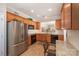Kitchen features wood cabinets, granite countertops, stainless steel appliances, and wood floor at 7406 Carolina Jessamine Ct, Indian Land, SC 29707
