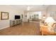 Bright living room with wood floors, neutral paint, and a large window overlooking the backyard at 7406 Carolina Jessamine Ct, Indian Land, SC 29707
