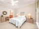 Bedroom features a ceiling fan, neutral decor, and large windows at 7406 Carolina Jessamine Ct, Indian Land, SC 29707