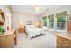 Spacious bedroom with a ceiling fan, large windows, and neutral decor at 7406 Carolina Jessamine Ct, Indian Land, SC 29707