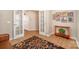 Office features wood floors, a colorful rug, french doors, and a decorative table at 7406 Carolina Jessamine Ct, Indian Land, SC 29707