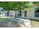 Back patio area featuring rocking chairs and room for entertaining at 7406 Carolina Jessamine Ct, Indian Land, SC 29707