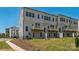 New construction townhome backyard featuring a private patio for outdoor relaxation and entertaining at 9212 Delancey Ln # 63, Concord, NC 28027