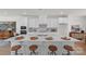 Modern kitchen with white cabinetry, quartz countertops, and stainless steel appliances at 9212 Delancey Ln # 63, Concord, NC 28027