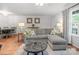 Inviting living room with comfortable seating, and access to dining area and front door at 9214 Arbourgate Meadows Ln, Charlotte, NC 28277