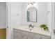 Bathroom featuring vanity with white counter, dark hardware, and a modern mirror and lighting at 929 Blacksnake Rd, Stanley, NC 28164