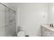 Bathroom featuring a glass-enclosed shower, toilet, and vanity with white cabinets at 929 Blacksnake Rd, Stanley, NC 28164