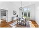 Sunlit dining room with large windows, hardwood floors, and designer touches throughout at 929 Blacksnake Rd, Stanley, NC 28164